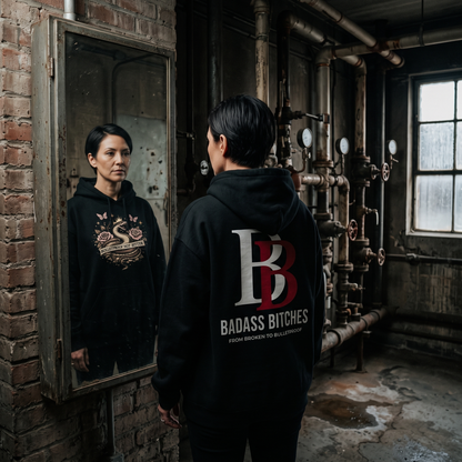 Women wearing a Bulletproof Not Bitter hoodie with 'Badass Bitches' logo in an industrial setting