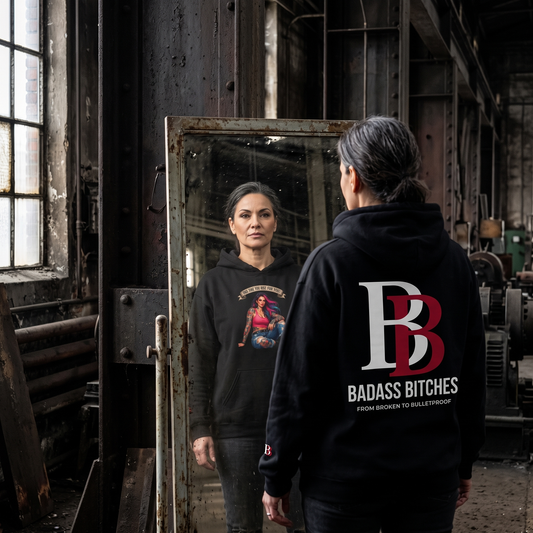 Women wearing a This Time You Rise For You hoodie with 'Badass Bitches' logo in an industrial setting