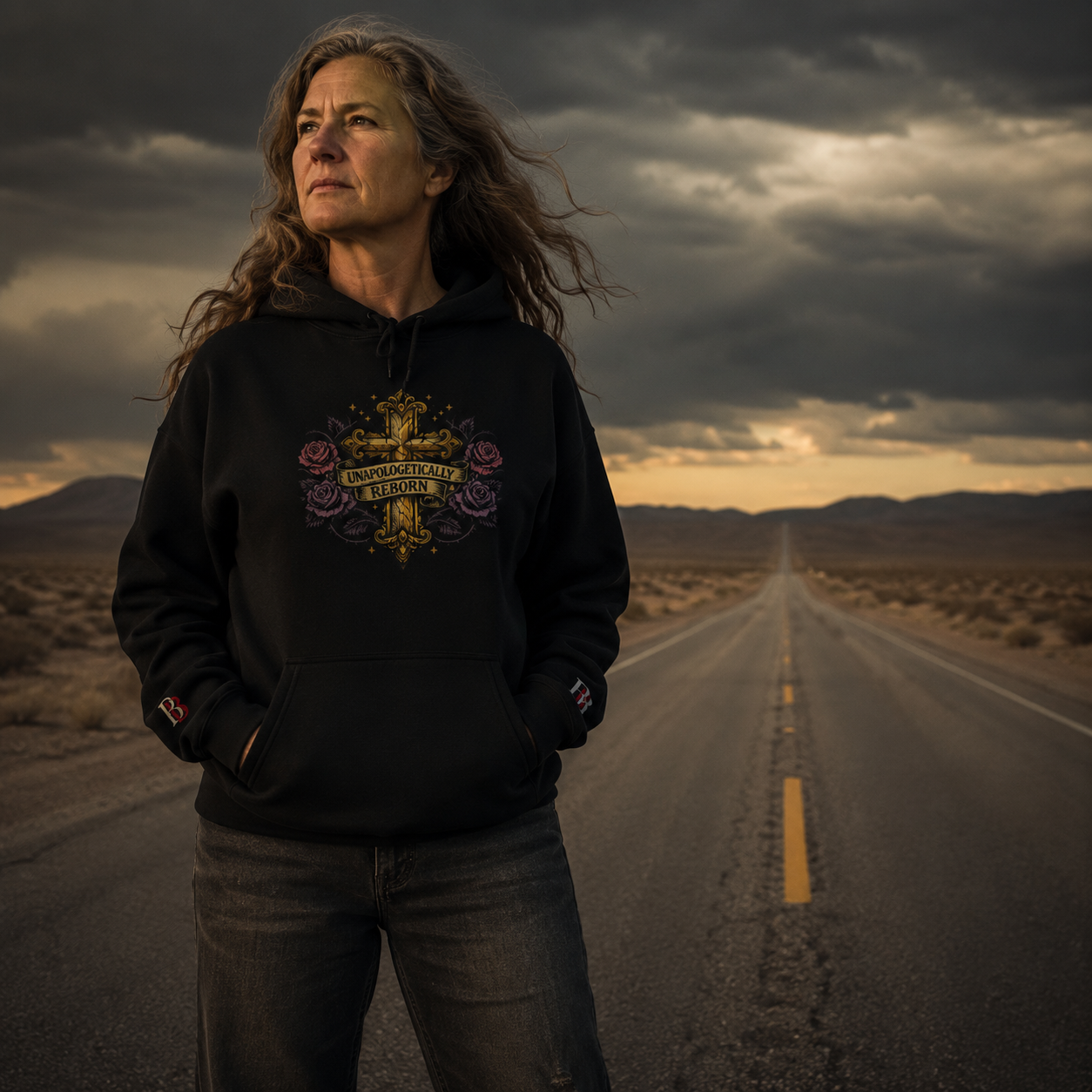 Black empowerment hoodie featuring "UNAPOLOGETICALLY REBORN" artwork on the front and Badass Bitches BB logo 