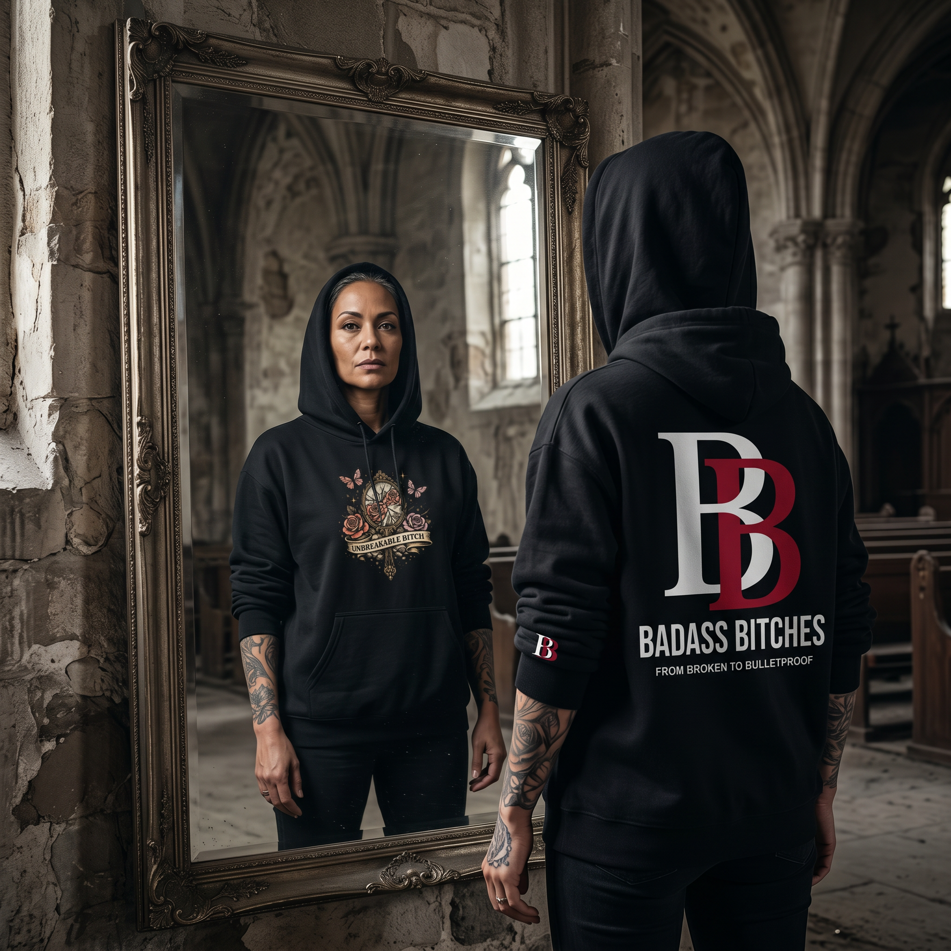 Womenwearing a Unbreakable Bitch hoodie with 'Badass Bitches' logo in a cathedral setting